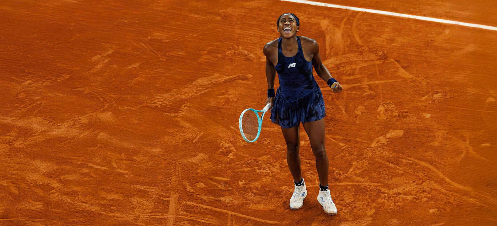 Young tennis athlete yelling for joy on the court. 